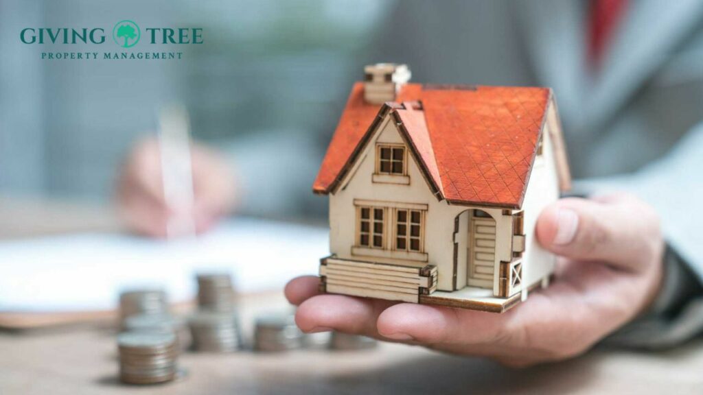 image of a small wooden house and some money in the background signifying the cost of property management